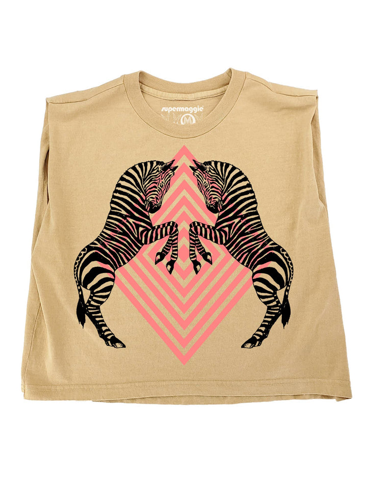 Beige sleeveless shirt with zebra design and pink geometric pattern on a white background