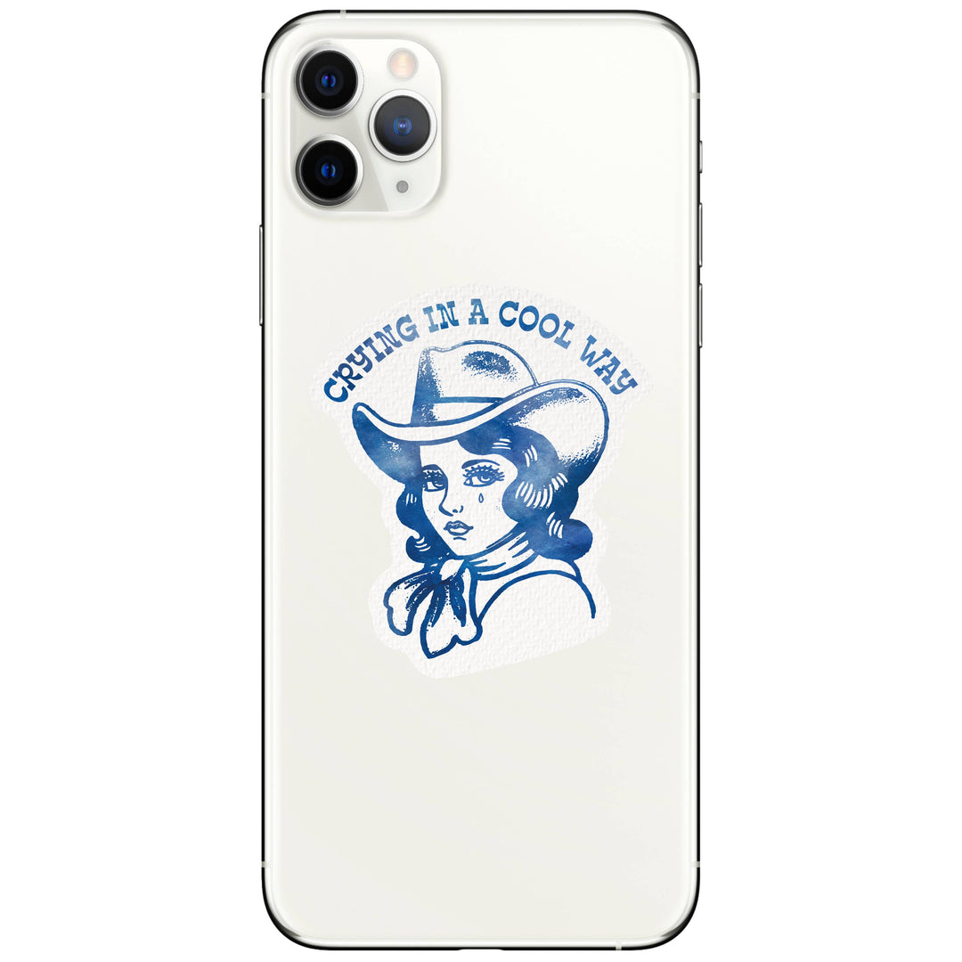 Phone case with a design of a woman in a cowboy hat and text 'Crying in a Cool Way' on a white background