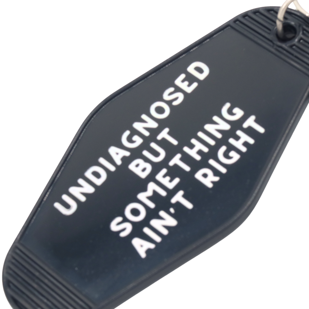 Something Ain’t Right Motel Keychain