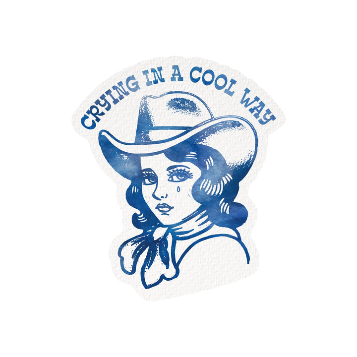 Sticker with a design of a person wearing a cowboy hat and text 'Crying in a Cool Way' on a white background.