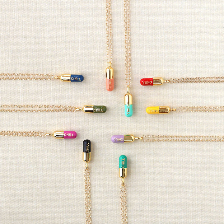 colorful necklaces with pill charms that say chill