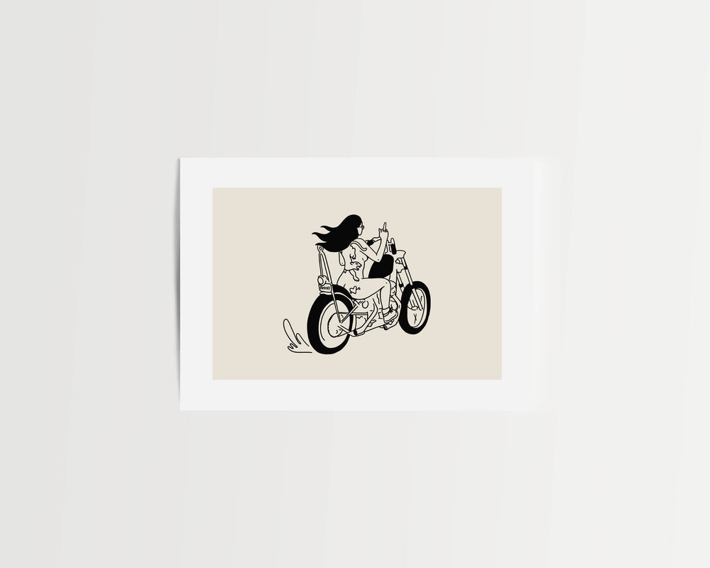 Framed artwork of a black line drawing of a person on a motorcycle on a beige background