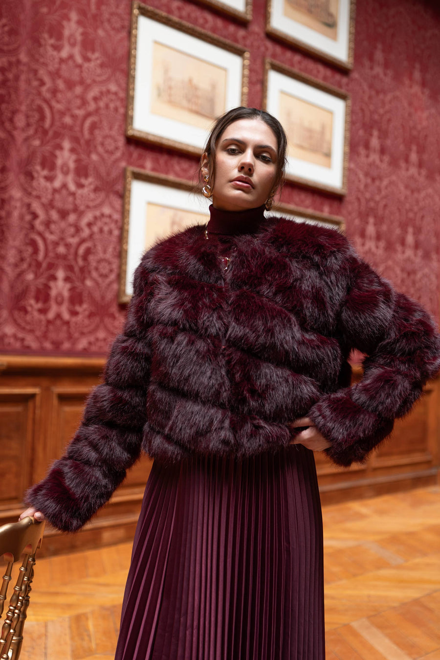 Model wearing short faux fur jacket with front button closure – For The Love LV boutique Las Vegas